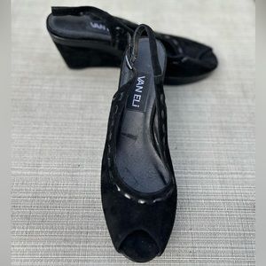 Van Eli peep toe sling backs, in black suede like material.Wedge heel.Adjustable